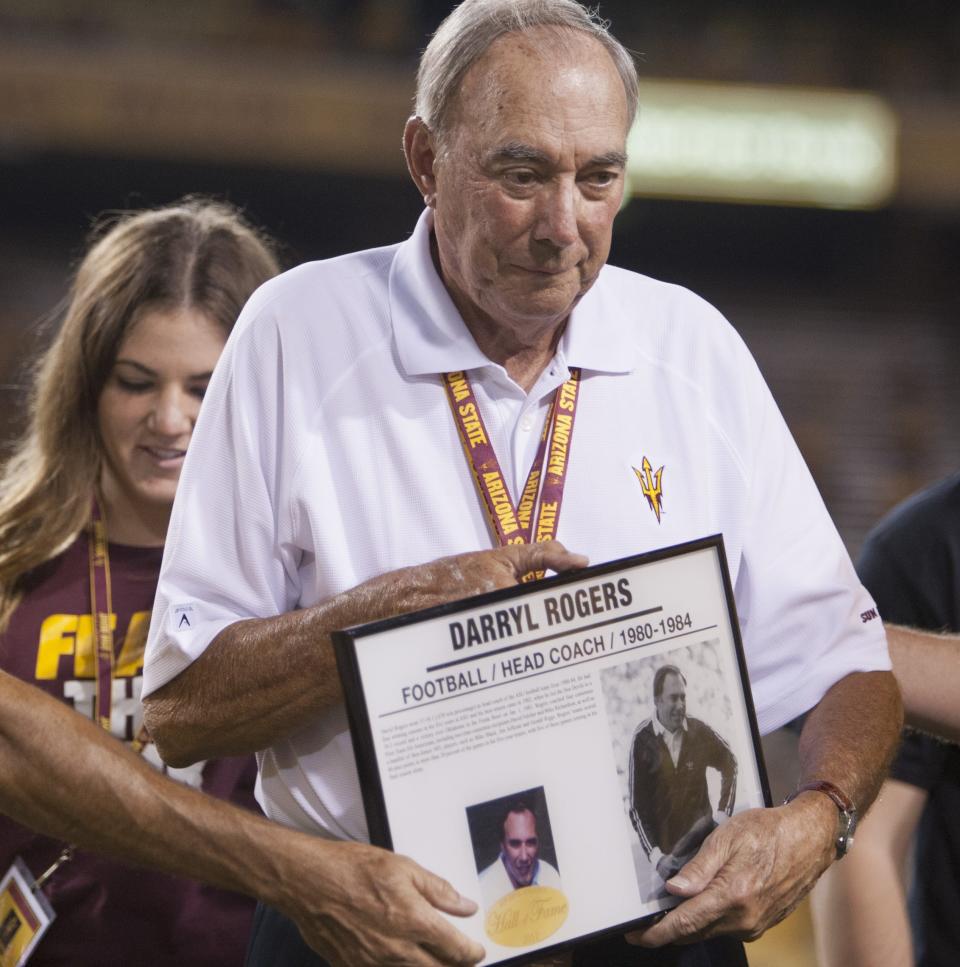 Former ASU football coach Darryl Rogers accepts his plaque as he is inducted into the ASU Hall of Fame at Sun Devil Stadium in Tempe AZ, on Sept. 22, 2012.