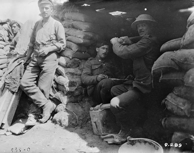 <p>Pumping air into a mine shaft, 22nd (French Canadian) Battalion, July 1916. Credit: Canada. Department of National Defence. Library and Archives Canada</p> 