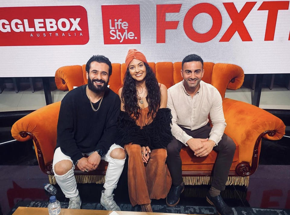 Gogglebox Australia's Matty and Sarah Marie Fahd & Jad Nehmetallah on an orange sofa