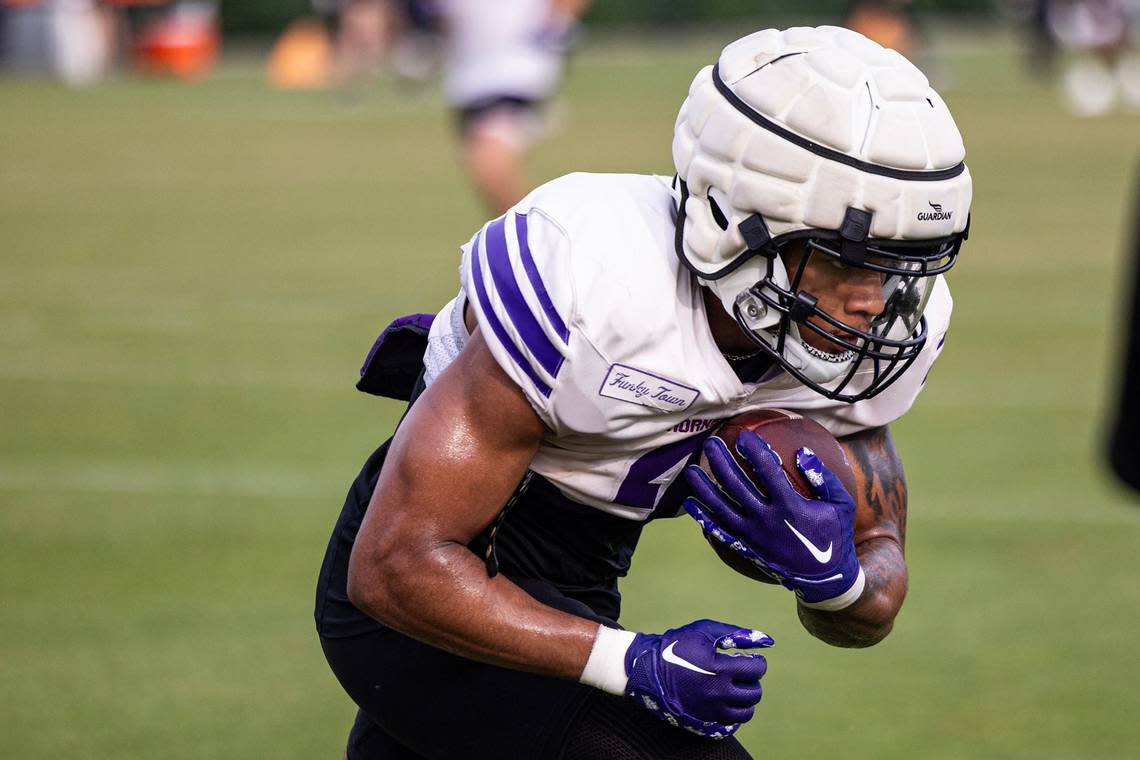 TCU running back Cameron Cook (4) participates in a drill during a spring practice at the Sheridan & Clif Morris Football Practice Fields in Fort Worth on Wednesday.