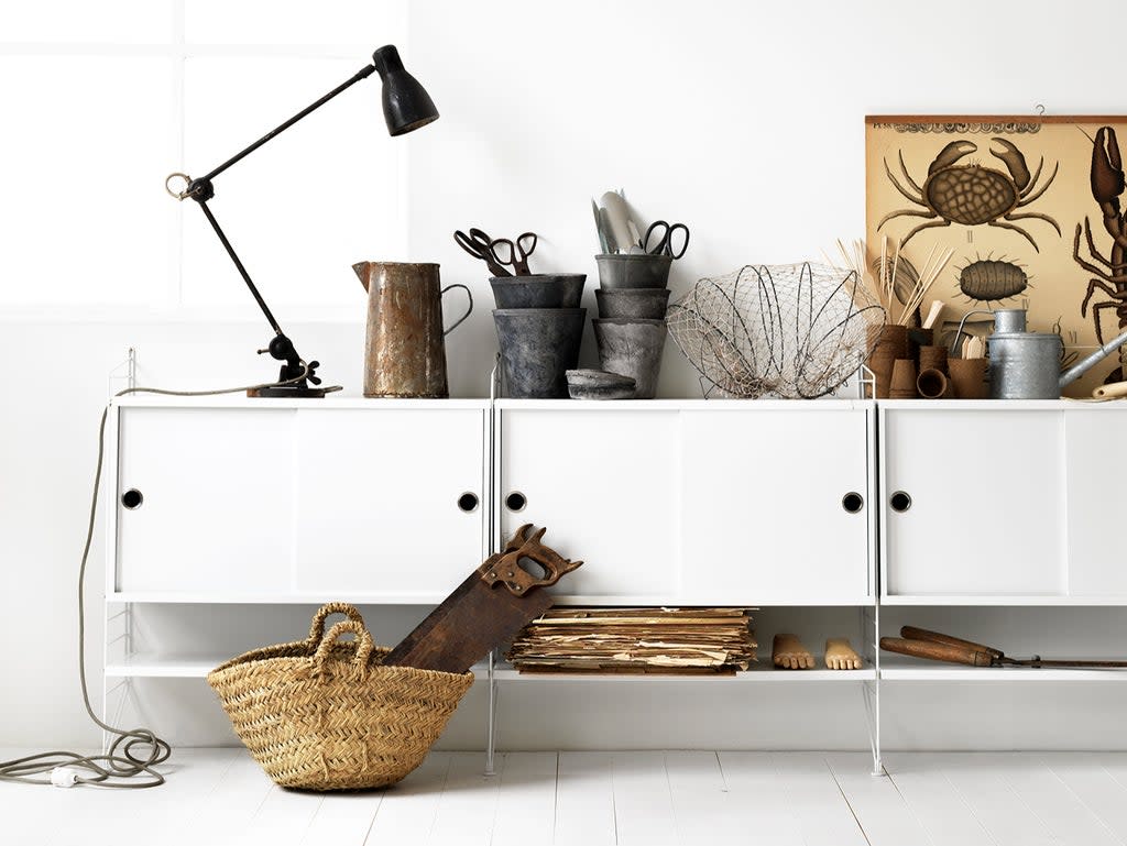 String shelving makes a subtle design statement without distracting from the flow of the room (string)