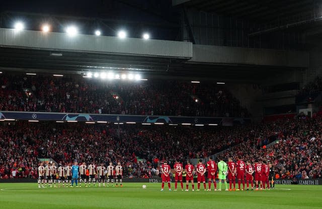 Liverpool and Ajax players, officials and fans observe a minute’s silence in memory of the Queen 