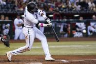 Arizona Diamondbacks' Geraldo Perdomo hits an RBI single against the San Francisco Giants during the fifth inning of a baseball game Tuesday, July 5, 2022, in Phoenix. (AP Photo/Ross D. Franklin)