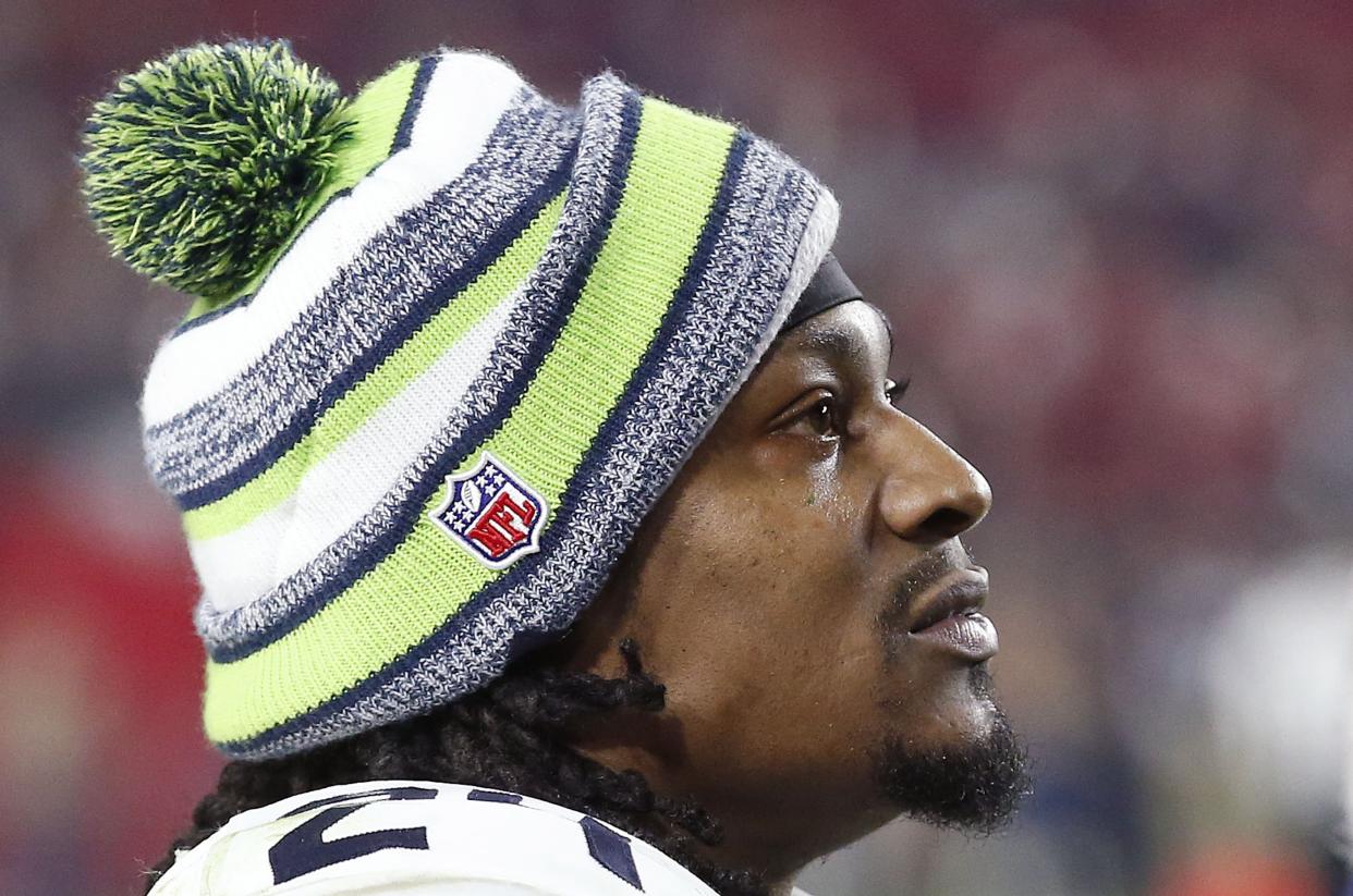Seattle Seahawks' Marshawn Lynch watches  the closing moments of an NFL football game against the Arizona Cardinals Sunday, Dec. 21, 2014, in Glendale, Ariz.  The Seahawks defeated the Cardinals 35-6. (AP Photo/Ross D. Franklin)