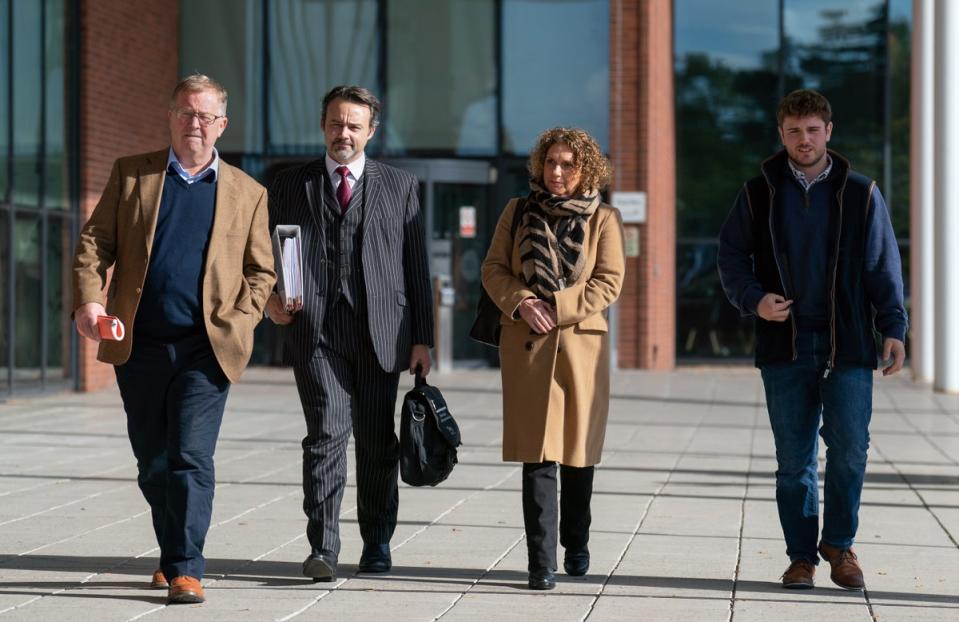 Hannah Ingram-Moore (second left), with husband Colin (left) and son Benjie (right), at Central Bedfordshire Council in Chicksands, Bedfordshire, for a hearing to appeal against an order to demolish an unauthorised spa pool block built at her home (Joe Giddens/PA Wire)