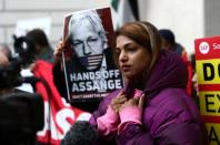 Supporters of WikiLeaks' founder Julian Assange gather outside Westminster Magistrates Court in London