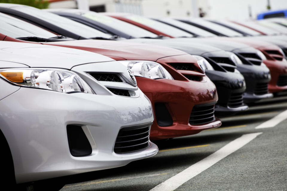 Dartmouth, Nova Scotia, Canada - June 12, 2011: New Toyota Vehicles in a Row at Car Dealership.  Founded in 1937, Toyota is one of the largest automobile manufacturers in the world.  They manufacturer a variety of automobiles including the continually popular Corolla and Camry.