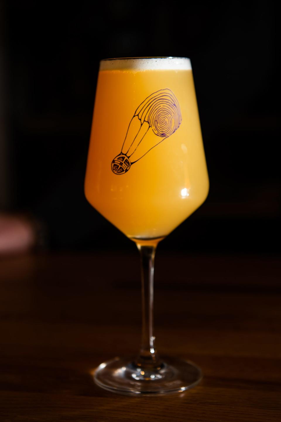 A glass of draft beer stands on the bar at Foreign Objects Brewery in Monroe, NY on Thursday, Jan. 13, 2022.