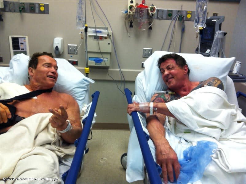 Schwarzenegger (left) and Sylvester Stallone in 2012 following shoulder surgeries.