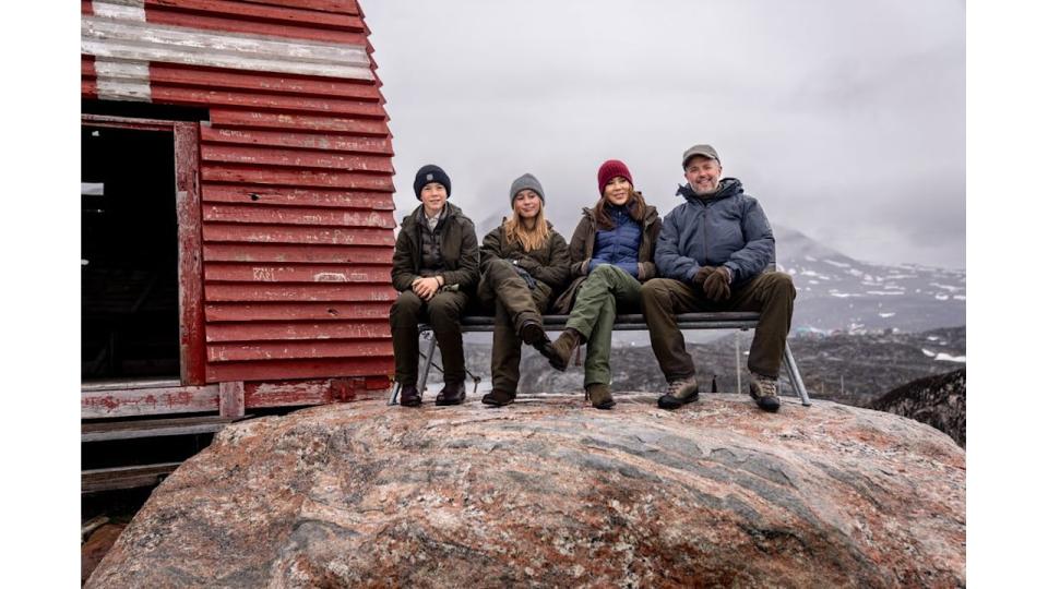 Denmarks's King Frederick X, Queen Mary, Princess Josephine and Prince Vincent pose on a bench during a visit in Qeqertarsuaq in Greenland,