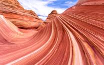 <p><a href="https://antelopecanyon.az/get-permit-wave-arizona/" rel="nofollow noopener" target="_blank" data-ylk="slk:The Wave;elm:context_link;itc:0;sec:content-canvas" class="link ">The Wave</a> is unlike anything you’d ever see in the United States, let alone the world. It’s an Instagrammer’s dream — no filter needed. In northern Arizona on the border of Utah, this sandstone trough is made of colorful and waving ground lines as a result of rock erosions. </p><p>Visiting can be a challenge, as only 20 permits are allocated per day. This means that you should plan your visit at least 6 months in advance to try to get a spot. </p>