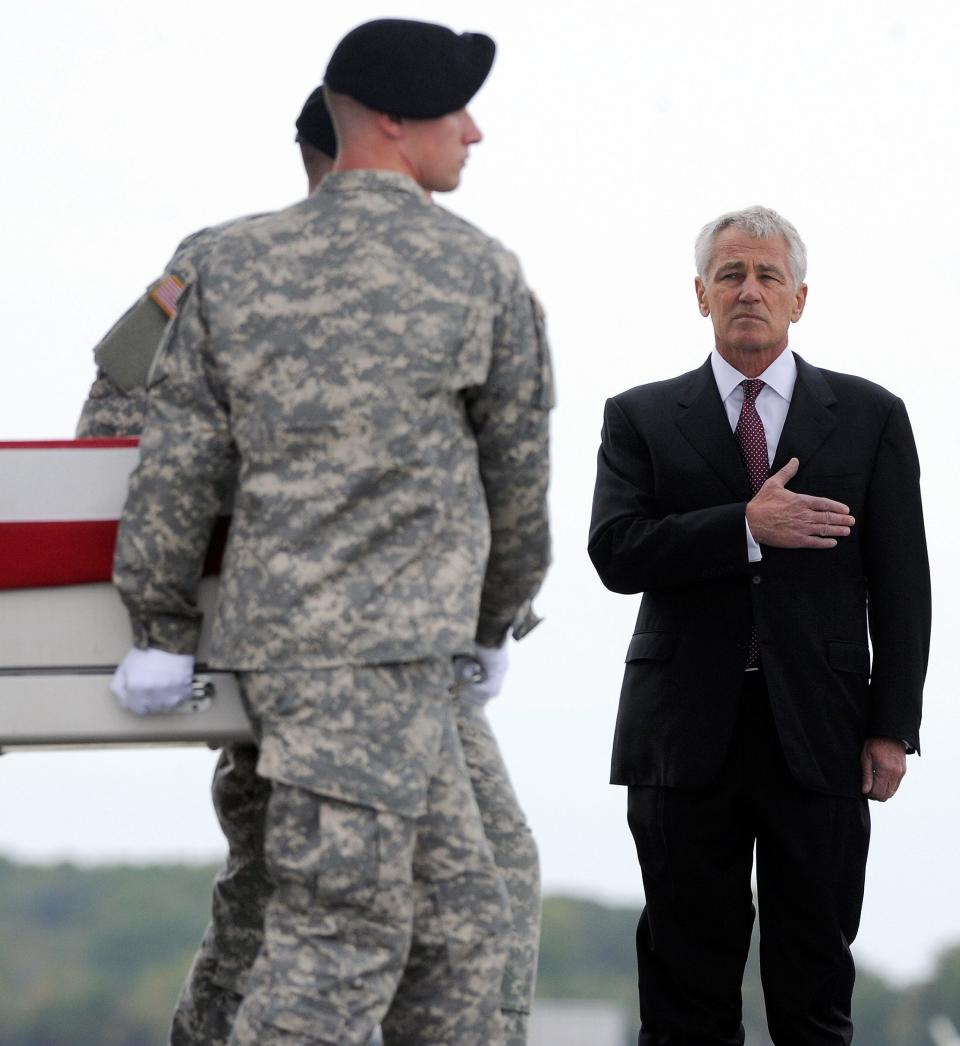 Defense Secretary Chuck Hagel presides over the return of a U.S. soldier's remains in October 2013 at Dover Air Force Base in Delaware.