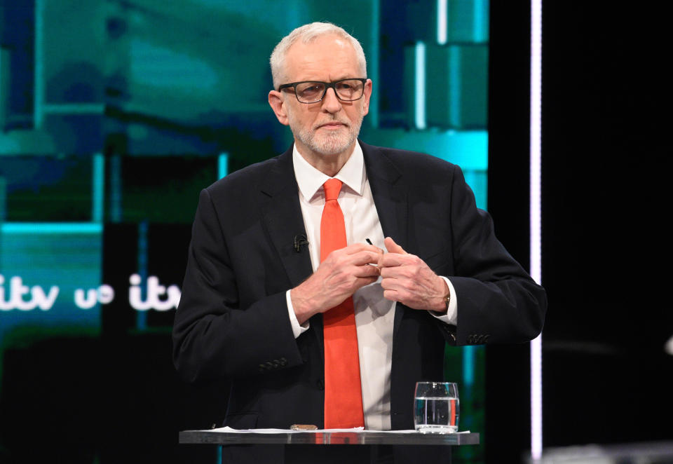 SALFORD, ENGLAND - NOVEMBER 19: (AVAILABLE FOR EDITORIAL USE UNTIL DECEMBER 19, 2019) In this handout image supplied by ITV,  Leader of the Labour Party Jeremy Corbyn arranges his glasses during the ITV Leaders Debate at Media Centre on November 19, 2019 in Salford, England. This evening ITV hosted the first televised head-to-head Leader’s debate of this election campaign. Leader of the Labour party, Jeremy Corbyn faced Conservative party leader, Boris Johnson after the SNP and Liberal Democrats lost a court battle to be included. (Photo by Jonathan Hordle//ITV via Getty Images)