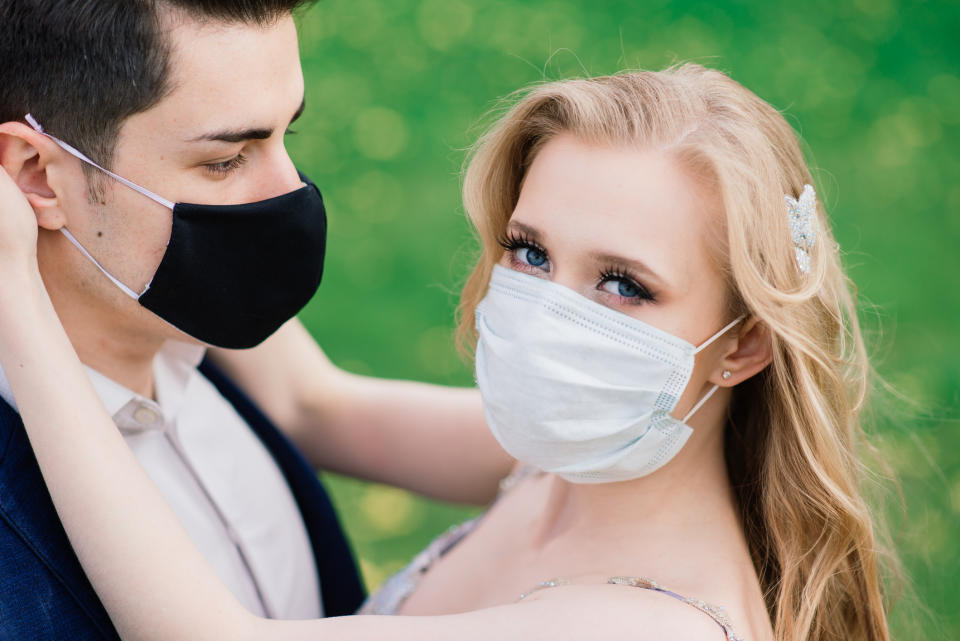 Couple wearing masks at their wedding