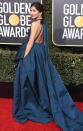 in a blue Valentino Haute Couture halter gown to the Golden Globe Awards.