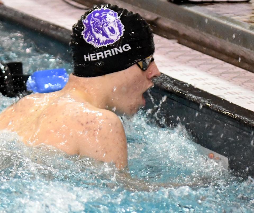 Jackson's Ezra Herring finishes his leg of Boys 400 Yard Freestyle Relay of the 2022 OHSAA Division I Swimming Prelims at C.T. Branin Natatorium.  Friday,  February 25, 2022. 