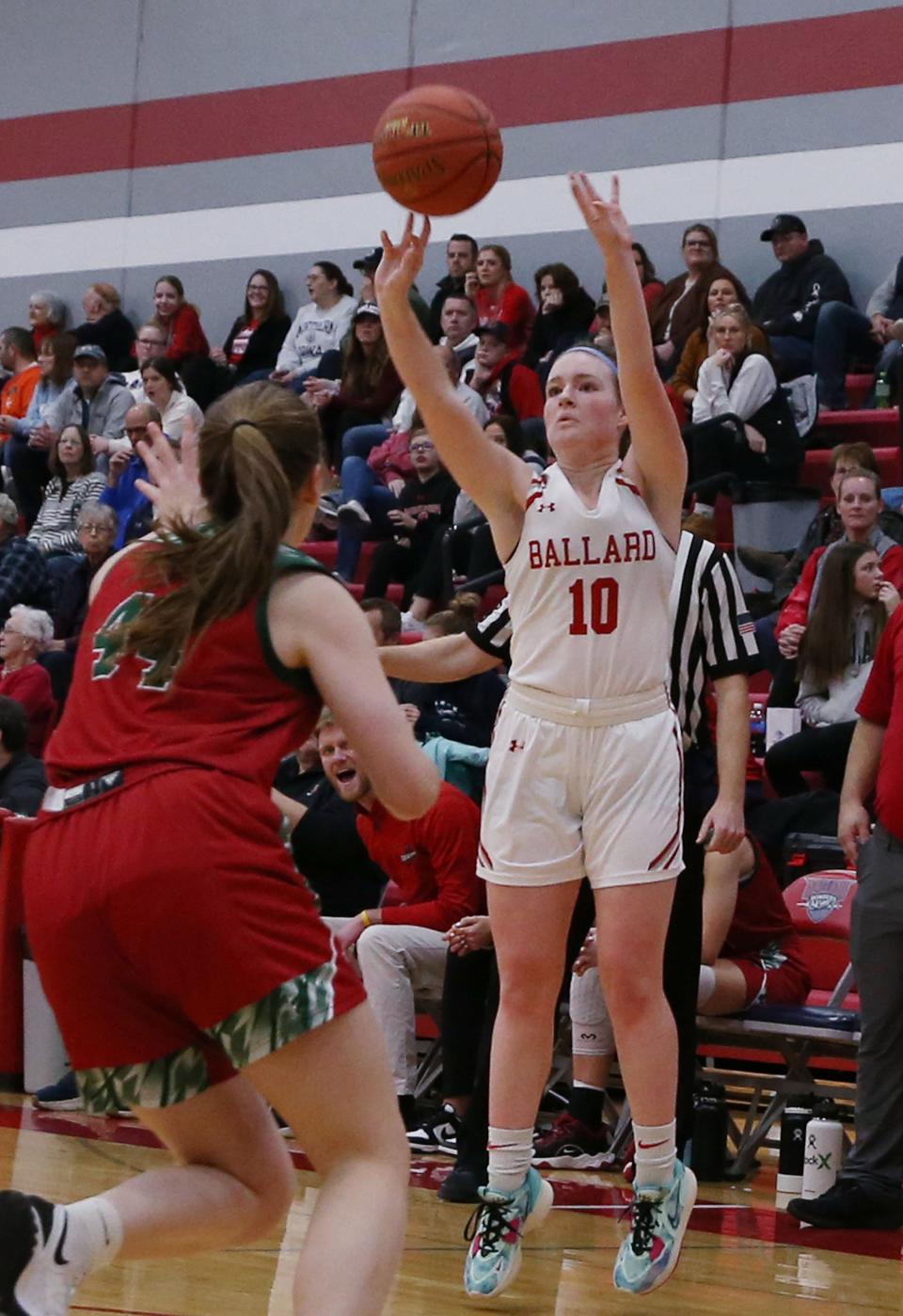 Ballard's Kiley Calvert (10) takes a 3-point shot over Boone forward Savannah Paul (44) during the second quarter of the Bombers' 60-23 victory over the Toreadors at Ballard High School Thursday, Jan. 20. 2023, in Huxley, Iowa.