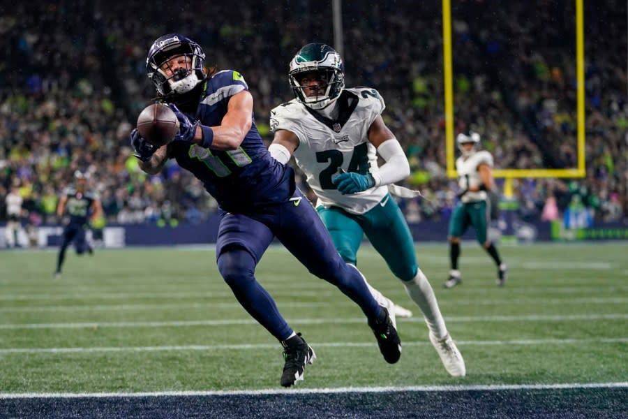 Seattle Seahawks wide receiver Jaxon Smith-Njigba (11) makes a touchdown catch in front of Philadelphia Eagles cornerback James Bradberry (24) during the second half of an NFL football game, Monday, Dec. 18, 2023, in Seattle. The Seahawks won 20-17. (AP Photo/Lindsey Wasson)