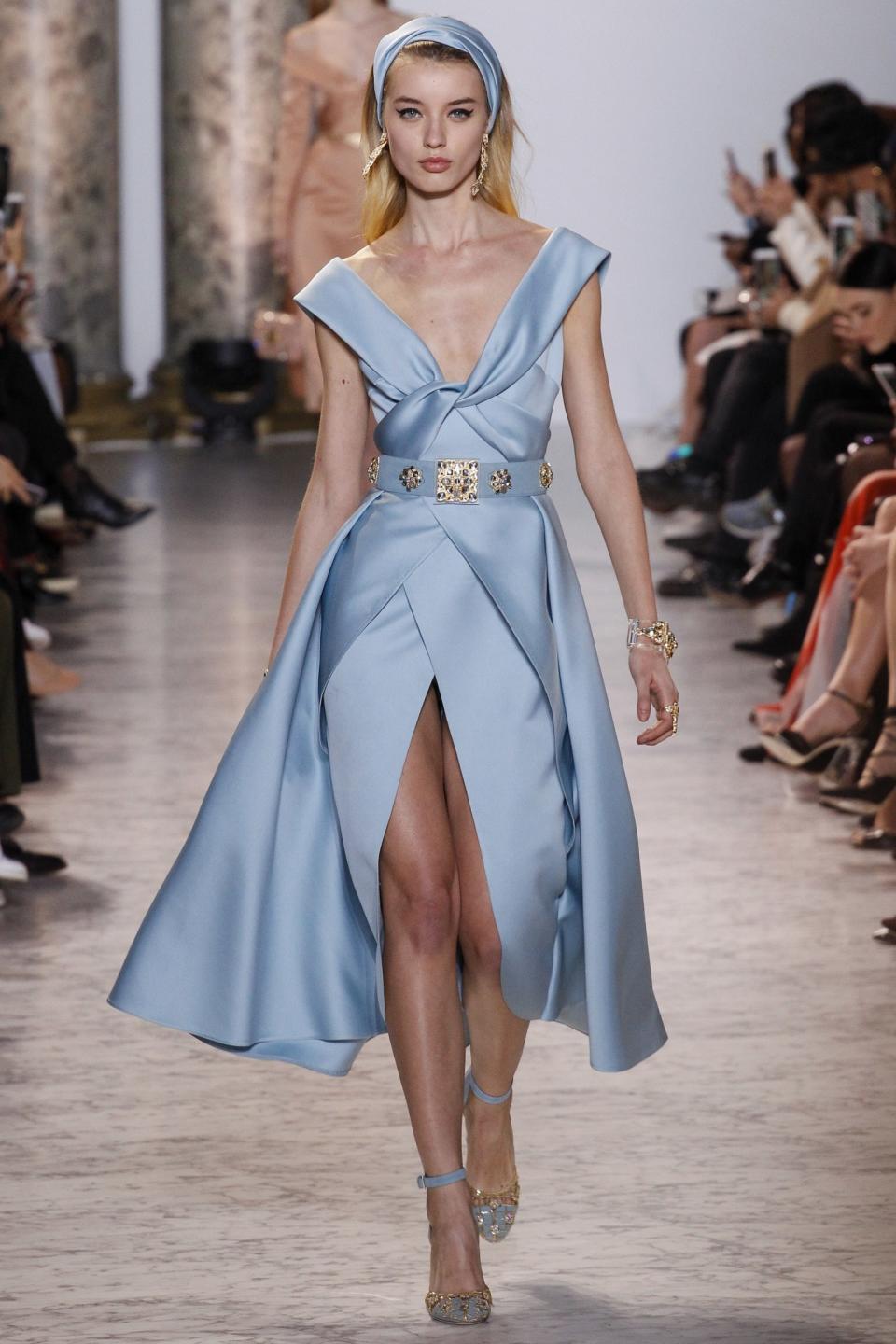 <p>A deep V knotted neckline dress in an icy blue hue is an exquisite way to open the show! (Photo: Getty Images) </p>