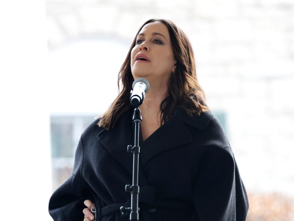 Alanis Morissette performs onstage at the public memorial for Lisa Marie Presley.