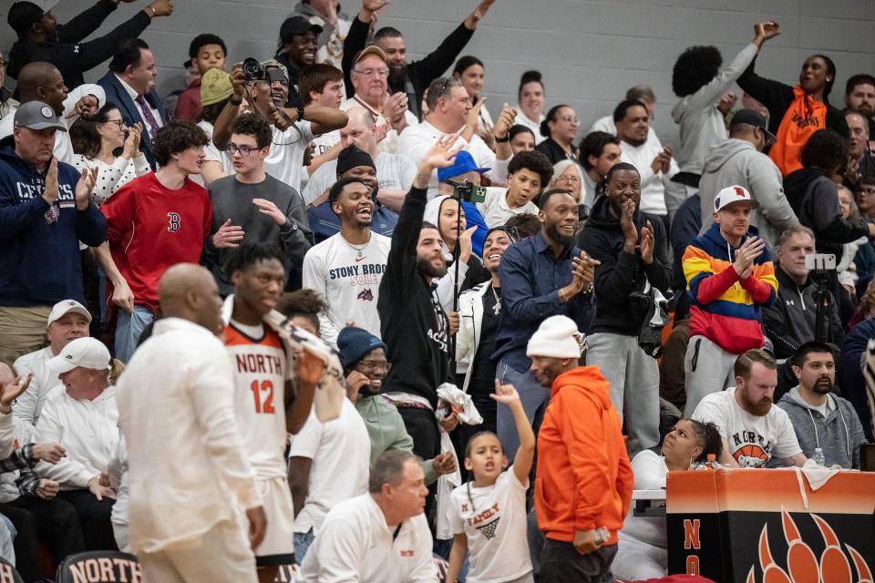 North High fans celebrate during Tuesday's D1 second round playoff in Worcester.