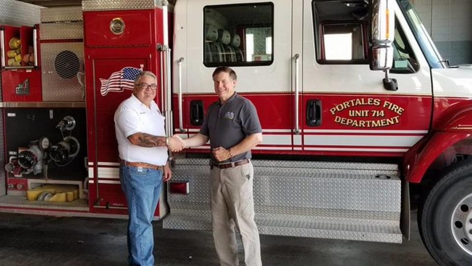 N.C. Insurance Commissioner Mike Causey, right, at the Portales (N.M.) Fire Department on Aug. 2, 2019.