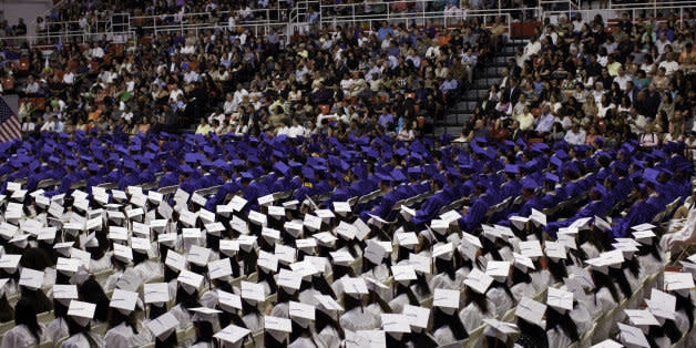 NEW YORK - JUNE 24: Bayside High School seniors sit during their June 24, 2011 graduation ceremony held on the St John's University campus in the Queens borough of New York. Nearly 1000 students went through the graduation ceremony. Of the approximately 3,900 students at Bayside, Asian-American students are the largest group, with 46.5% of the student population. 99% of graduating Bayside seniors were accepted to college in 2009. (Photo by Robert Nickelsberg/Getty Images)