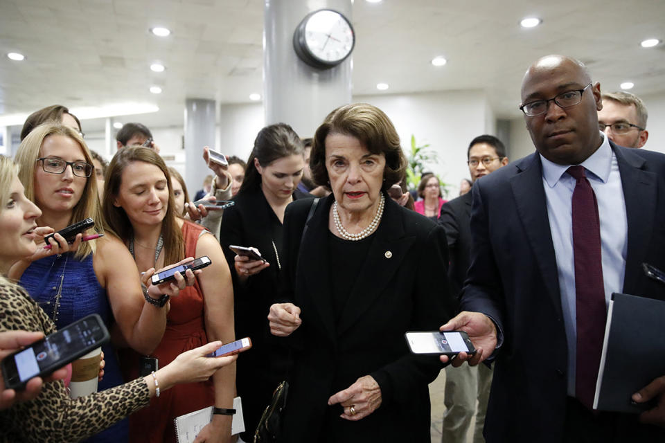 Sen. Dianne Feinstein, D-Calif., listens to reporter's questions on Capitol Hill, Wednesday, Oct. 3, 2018 in Washington. (AP Photo/Alex Brandon)