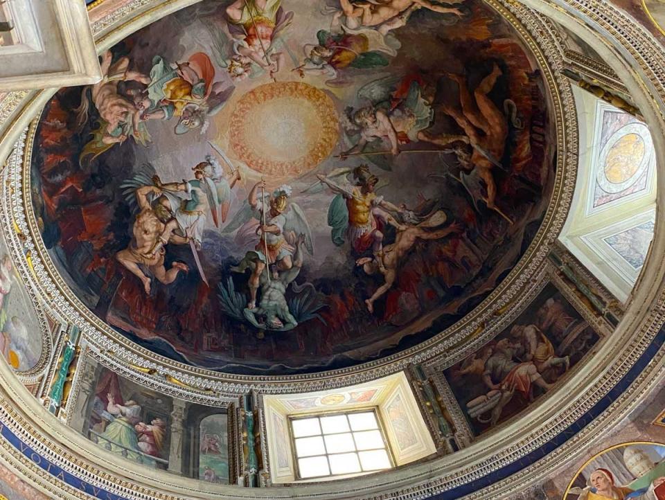 Looking up at the ceiling inside a room at the Vatican in Italy.