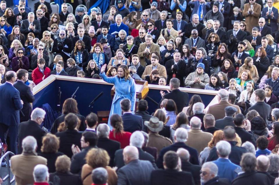 Kentucky Lt. Gov. Jacqueline Coleman waves to the crowd before taking the oath of office outside the state Capitol in Frankfort, Ky., on Tuesday, Dec. 12, 2023.