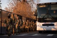 <p>Members of the National Guard arrive to the East Front of the Capitol in Washington on Tuesday, Jan. 12, 2021.</p>