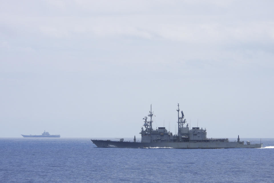 FILE - In this photo released by the Taiwan Ministry of National Defense, Taiwanese navy ship Keelung, foreground, a U.S. made Kidd Class destroyer, monitors the Chinese aircraft carrier Shandong, background, near the Taiwanese waters on September 2023. (Taiwan Ministry of National Defense via AP, File)