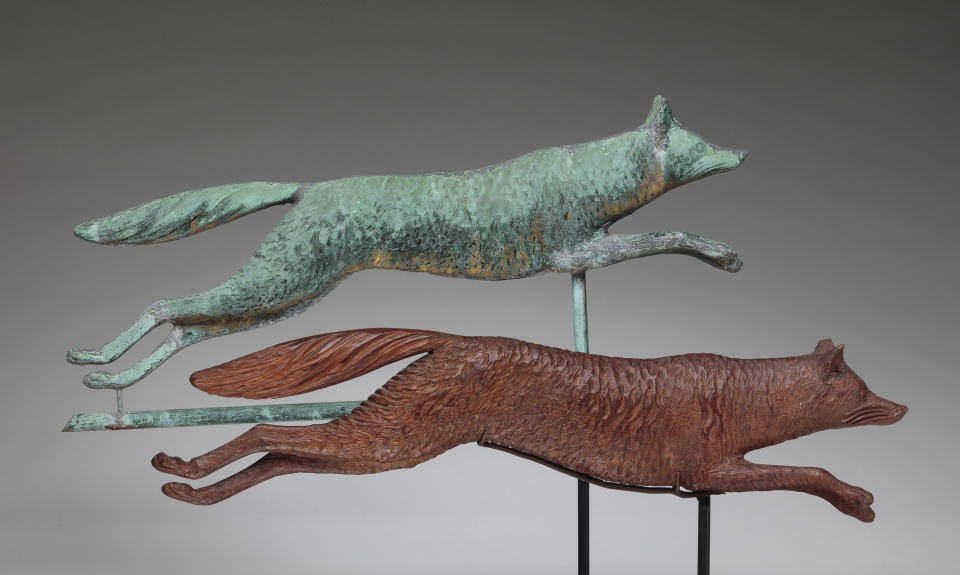 This image provided by the American Folk Art Museum shows a copper fox weather vane. Perched atop churches, barns, businesses, homes and seats of government for hundreds of years, weather vanes have taken the form of everything from farm animals to pets, storybook figures to race cars. They were invented for one important job: telling which way the wind was blowing. Gradually, they became appreciated as an art form. (Richard Goodbody/American Folk Art Museum via AP)