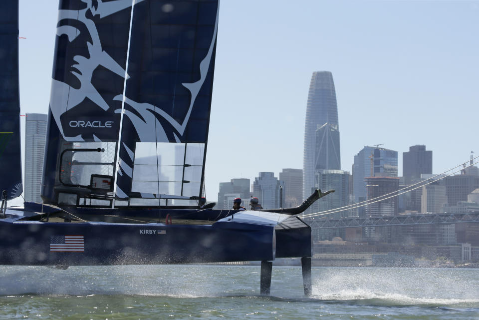 The U.S. team F50 foiling catamaran trains after its launch Monday, April 22, 2019, in San Francisco. New global sports league SailGP launched the first of six F50 race boats into San Francisco Bay that will compete May 4-5. The 50-foot long catamaran is capable of hitting speeds of 60 miles per hour. In the background is the Salesforce Tower. (AP Photo/Eric Risberg)