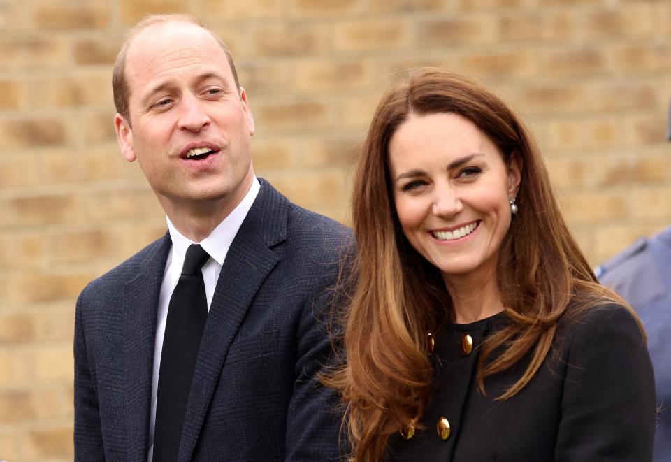 Britain's Prince William, Duke of Cambridge, and Britain's Catherine, Duchess of Cambridge, wearing black as a mark of respect following the death of Britain's Prince Philip, Duke of Edinburgh, talk with Air Cadets during their visit to 282 (East Ham) Squadron Air Training Corps in east London on April 21, 2021