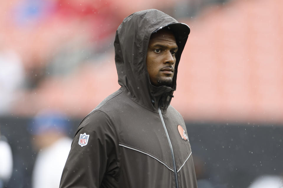 Cleveland Browns quarterback Deshaun Watson walks on the fields with the team as they warm up before an NFL preseason football game against the Philadelphia Eagles in Cleveland, Sunday, Aug. 21, 2022. (AP Photo/Ron Schwane)