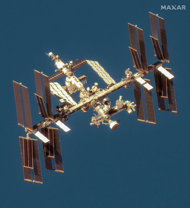 FILE PHOTO: A satellite image shows an overview of the International Space Station with the Boeing Starliner spacecraft