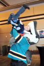 OTTAWA, ON - JANUARY 27: San Jose Sharks mascot S.J. Sharkie poses with Ethan Bathurst of Ottawa during the NHL Fan Fair at the Ottawa Convention Centre on January 27, 2012 in Ottawa, Ontario, Canada. (Photo by Bruce Bennett/Getty Images)