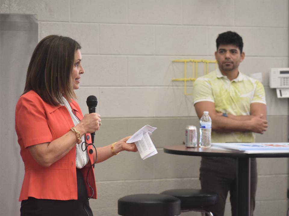 Bronna Kahle, left, president and CEO of the Lenawee Community Foundation, talks about the many years of financial impact Brazeway in Adrian has made throughout Lenawee County through its charitable giving efforts during an event May 10 at Brazeway. Also pictured is Jose Salazar, corporate human relations generalist and a two-year team member with Brazeway.