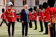 <p>President Biden inspecting the guard of honour.</p>