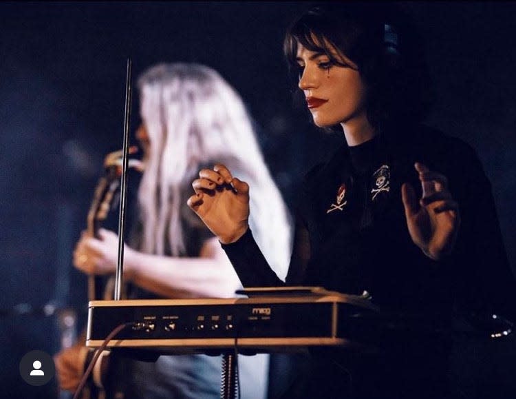 Holland native Via Mardot playing the theremin during a show.