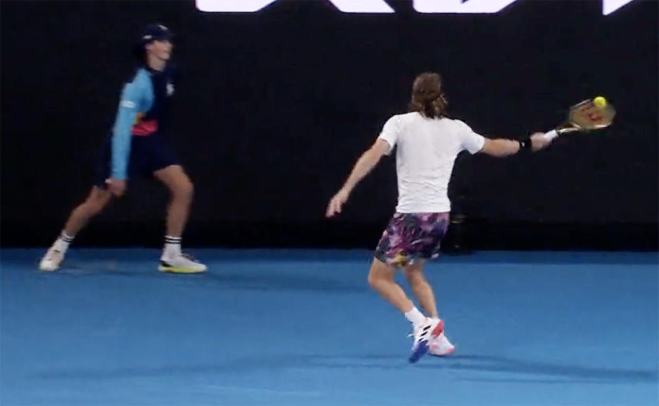 Stefanos Tsitsipas, pictured here hitting a ball in anger that nearly connected with a ball kid.