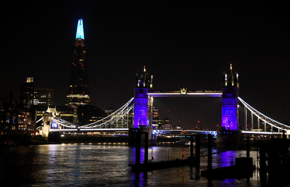 General view as Tower Bridge and the Shard are lit blue in support of the NHS, as the spread of the coronavirus disease (COVID-19) continues, London, Britain, March 26, 2020. REUTERS/Toby Melville