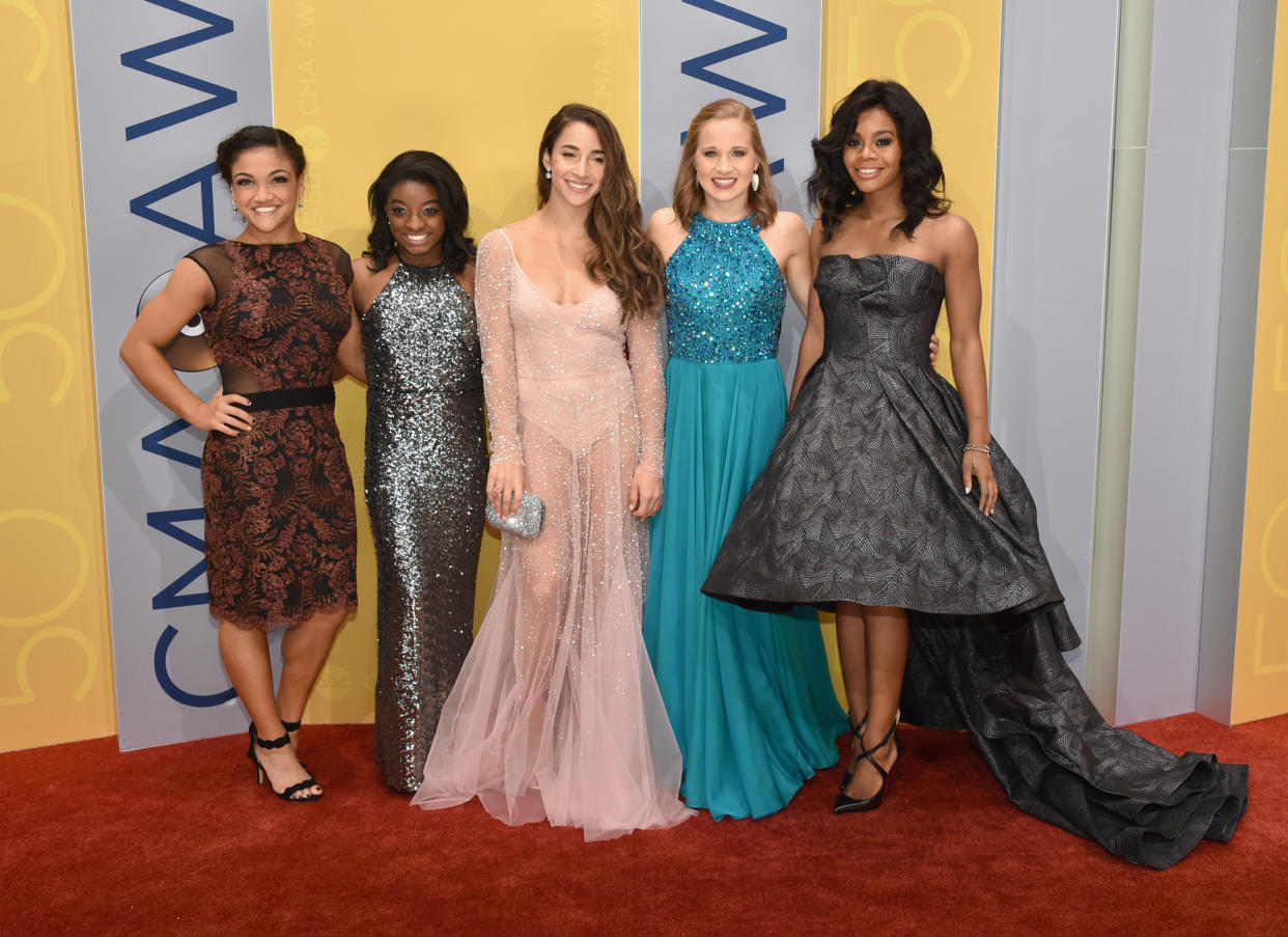 Olympic gymnasts Laurie Hernandez, left, Simone Biles, Aly Raisman, Madison Kocian and Gabby Douglas at the 50th annual CMA Awards in Nashville on Nov. 2, 2016, in Nashville. (Photo: John Shearer via Getty Images)