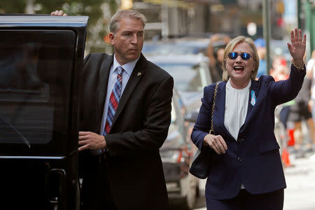 U.S. Democratic presidential candidate Hillary Clinton leaves her daughter Chelsea's home in New York, New York, United States September 11, 2016, after Clinton left ceremonies commemorating the 15th anniversary of the September 11 attacks feeling "overheated." REUTERS/Brian Snyder