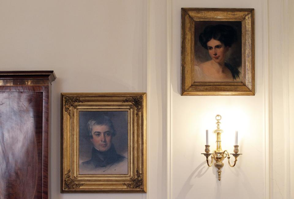 In this March 13, 2012 photo, a portrait of Maria Gratz, top right, hangs next to a portrait of her husband, Benjamin Gratz, in the Rosenbach Museum & Library in Philadelphia. The portrait of Maria Gratz by Thomas Sully joins nine others of the Gratz family at the museum. (AP Photo/Alex Brandon)