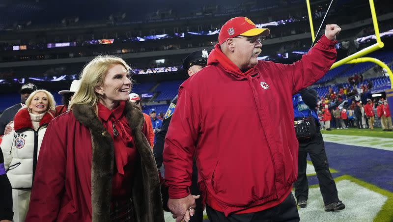 Kansas City Chiefs head coach Andy Reid walks off the field with his wife Tammy Reid after the AFC championship NFL game against the Baltimore Ravens, Sunday, Jan. 28, 2024, in Baltimore. The Chiefs won 17-10.
