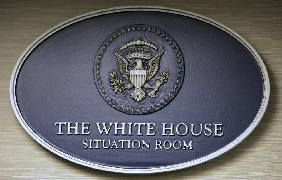 FILE - A plaque is seen on the wall in the Situation Room of the White House in Washington, May 18, 2007. (AP Photo/Charles Dharapak, File)