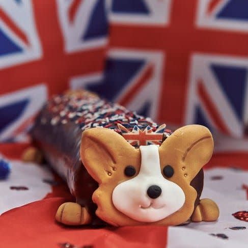 <p>Inspired by Her Majesty's beloved pet pooches, Morrisons has launched a corgi-shaped cake in celebration of the Queen's Platinum Jubilee. And tbh, we couldn't be more obsessed!</p><p>This chocolate-covered swiss roll comes decorated with red, blue and white sprinkles and even features sweet edible face and boots with a Union Jack crown.</p><p><a class="link " href="https://groceries.morrisons.com/products/clarence-the-corgi-cake-584534011" rel="nofollow noopener" target="_blank" data-ylk="slk:BUY NOW;elm:context_link;itc:0;sec:content-canvas">BUY NOW</a></p>