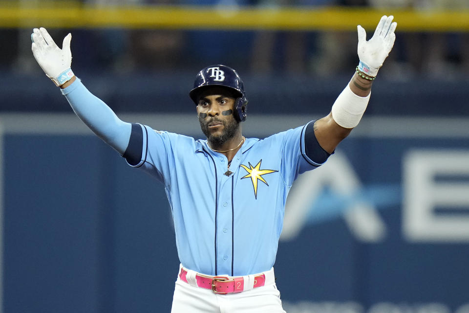 Tampa Bay Rays' Yandy Diaz celebrates his double off Toronto Blue Jays relief pitcher Jordan Romano during the ninth inning of a baseball game Saturday, Sept. 23, 2023, in St. Petersburg, Fla. (AP Photo/Chris O'Meara)